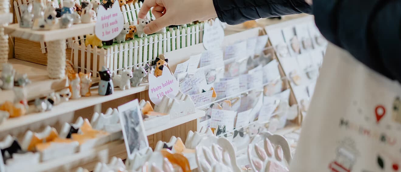 Stickers and art prints at a market stall